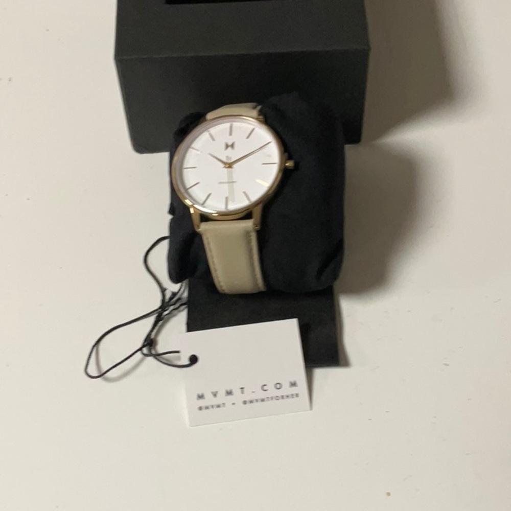 MVMT women’s watch, brand new.  Rose gold with tan strap.